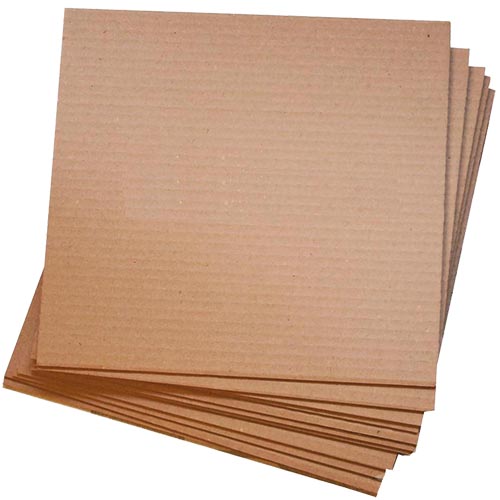 cardboard pads and sheets stacked on top of one another