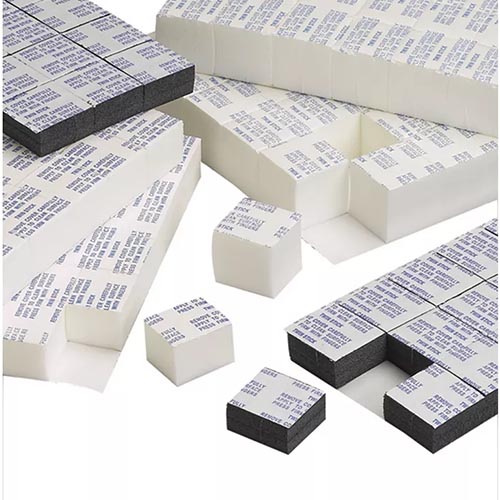 pieces of white foam with an adhesive backing
